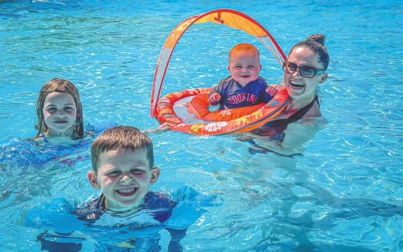 Family time in the pool is enjoyed by Natalie, Henry, Calvin and Julie Helm on a nice warm summer day. Photo by Caity Ryan