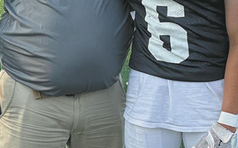 North Border head coach Tim Hartje and Eagles player Grant Cosley were both invited to the 51st North Dakota Shrine Bowl, held in Mayville on June 21. Photo by Larry Stokke.
