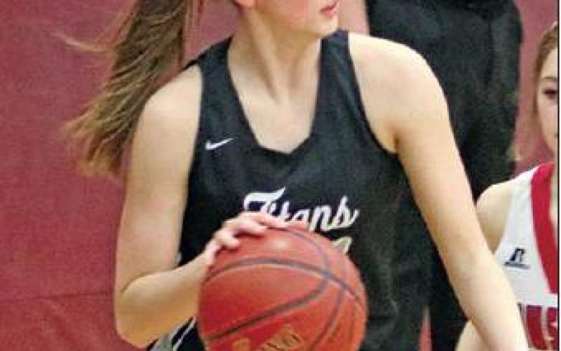 Emilee Reilly drives the ball around one of the Mustangs in Minto last week. Photo submitted by Kerri Stegman, Drayton Public School
