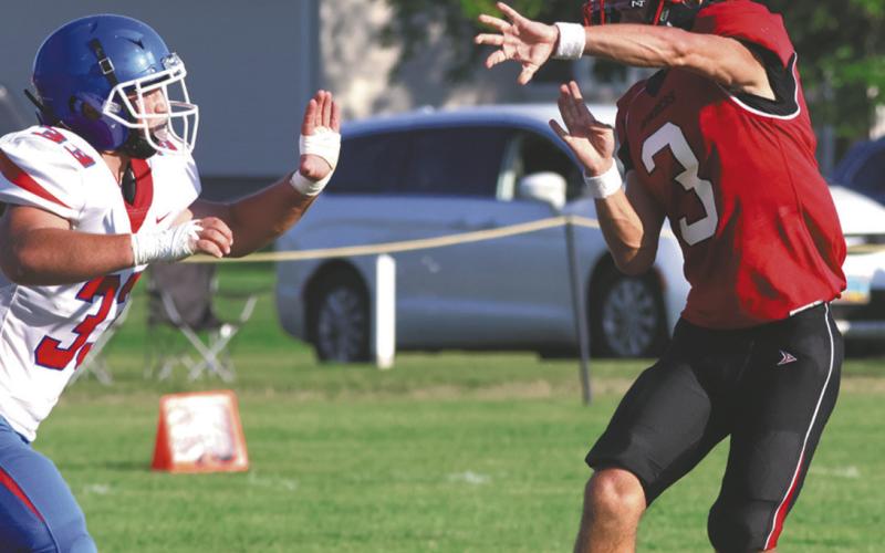 Trenten Keena gets a pass off before the defense can stop him. Photo by Lyle Van Camp