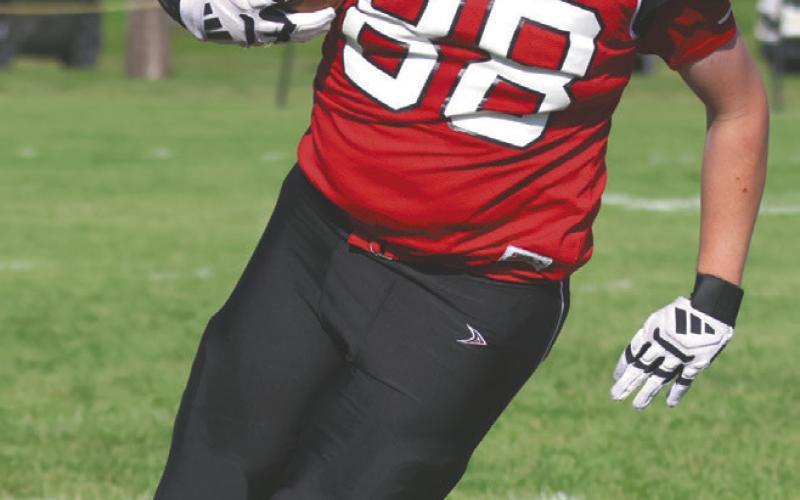 Braydon Klimpel picks up some yards for the Bombers. Photo by Lyle Van Camp