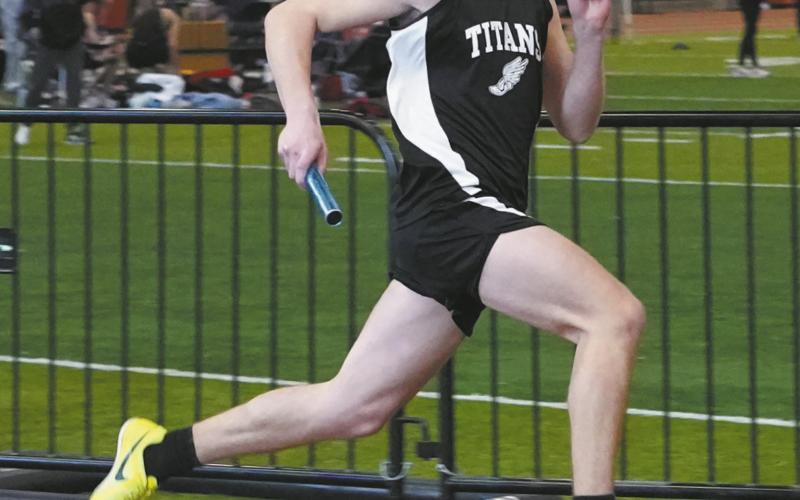 Senior Samual Kittelson took third and helped set a new school record in the 4X300 relay along with Carter Johnson, Carter Oberg, and Brady Reilly Photo by Larry Stokke