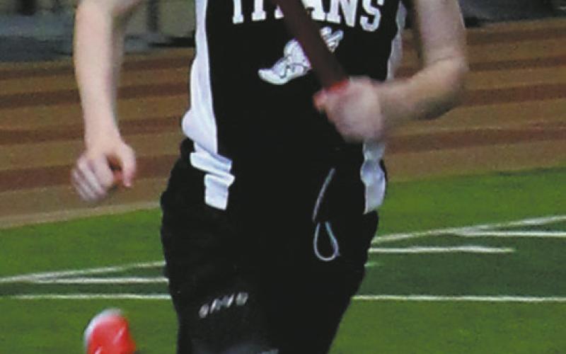 Benedict Burrell ran the 2nd leg of the boy’s 4x600 relay. They took 5th place. Photo by Jamie Rarick