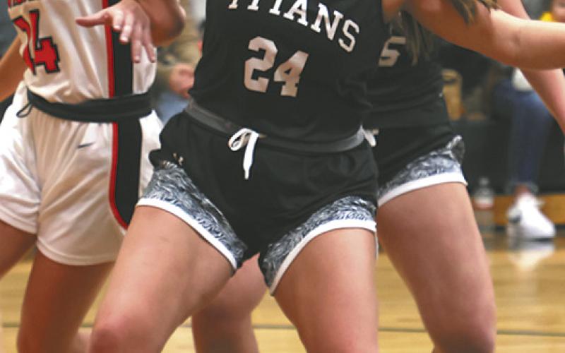 Hailey Berg fights for position on a rebound.