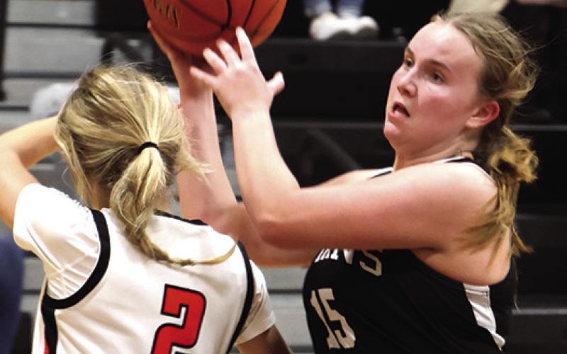 Aleah Pokrrzywinski steals the ball from Cavalier's Graesen Helgoe