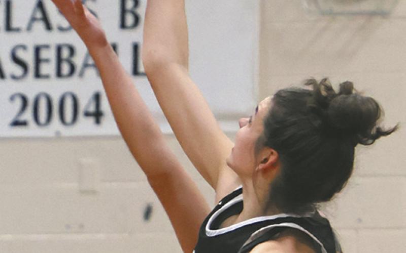 Elizabeth Fedje wins the opening tip off of the 2023/24 Titans Girls Basketball season.
