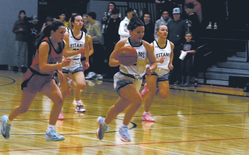 DVE junior Brooke Gullickson strips the ball and breaks away from the pack. Photo by Jamie Rarick