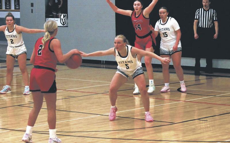 DVE senior Reese Fering defends against May-Port CG junior Kiaza Carlson. Photo by Jamie Rarick