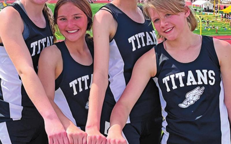 The girls 4 x 400 relay team finish off their season with a personal record. Pictured left to right: Easton Larson, Jayce Nelson, Elizabeth Fedje, and Alyssa Hoyles. Photo provided by Drayton Public School