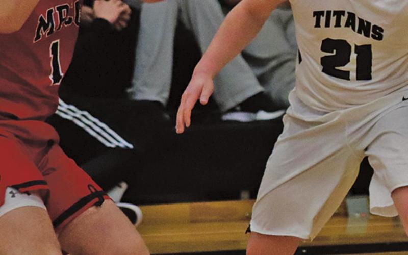 Alex Swanson guards Patriot Josh Evans last Thursday night in the Drayton gym. VNV Photo by Lesa Van Camp