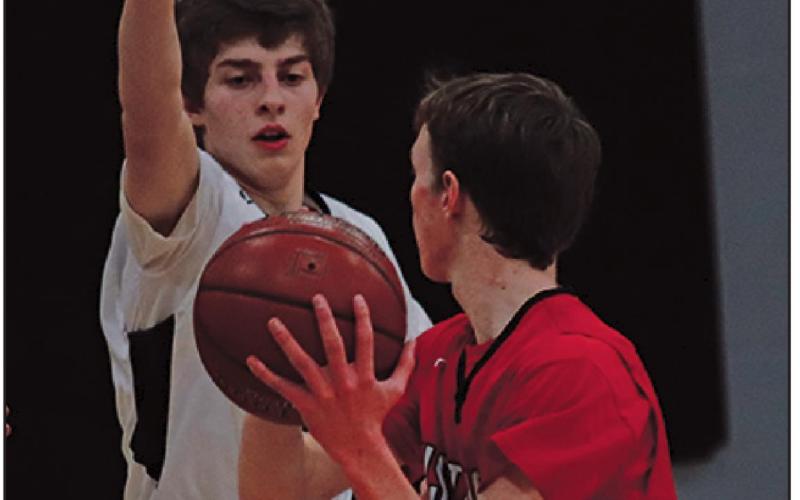 Sam Johnson tries to keep a Mustang from scoring. VNV Photo by Lesa Van Camp