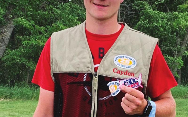 Cayden Quibell with his awards from the trapshooting season. Photo submitted