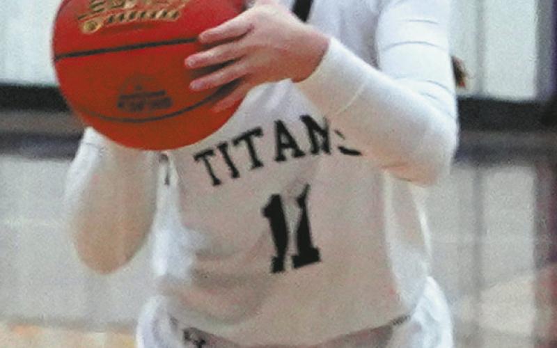 DVE junior, Jacey Nelson focuses on her three point shot during District play in Rolla. Photo by Larry Stokke