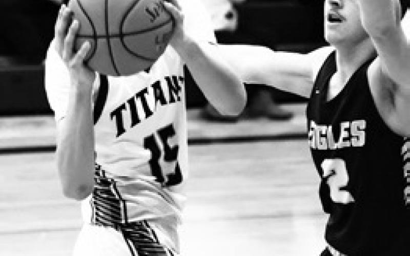 Jayse Gullickson looks for an open teammate in action against the Eagles. Photo by Lyle Van Camp.