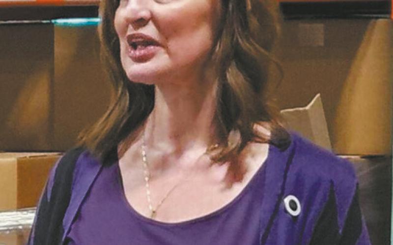 Robin Nelson speaks during an event at the Great Plains Food Bank on Dec. 19, 2024. Photo by Jeff Beach/North Dakota Monitor