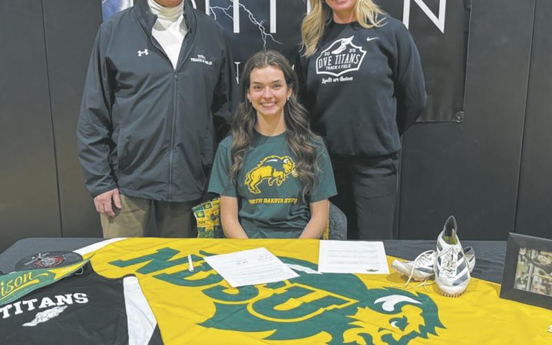 ‘FEDJE’ CON’T PAGE 10 Elizabeth Fedje with coaches Murph Thompson and Jodi Fedje. Submitted photo
