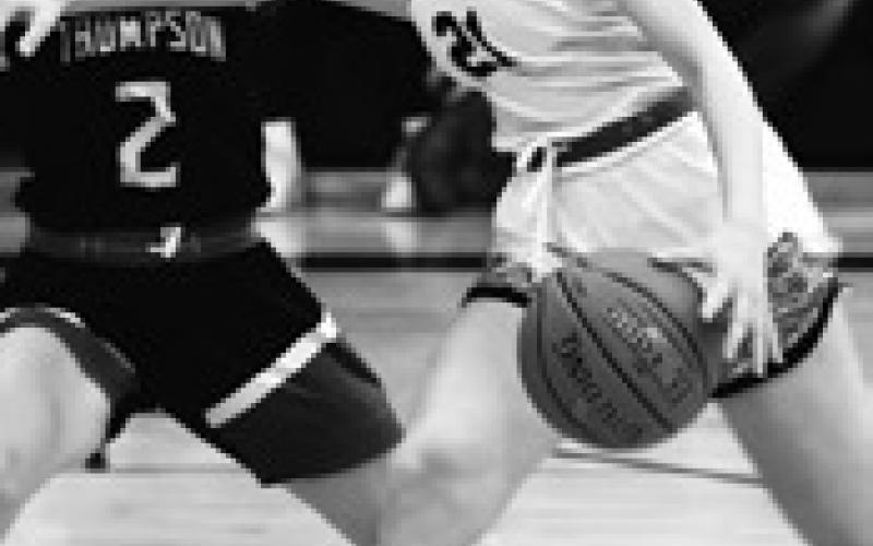 Elizabeth Fedje drives the ball past Sydney Schwabe. Photo by Lyle Van Camp