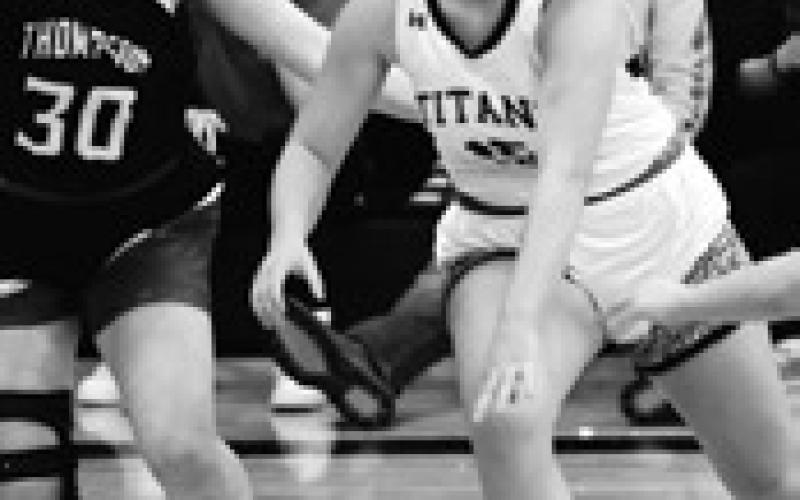 Aleah Pokrzywinski pushes the ball past Thompson's Jailin Avdem. Photo by Lyle Van Camp.
