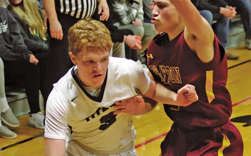 Brayden Johnson attempts to dribble around Spoiler Tony Villarreal who fiercely guards him. VNV photo by Lesa Van Camp
