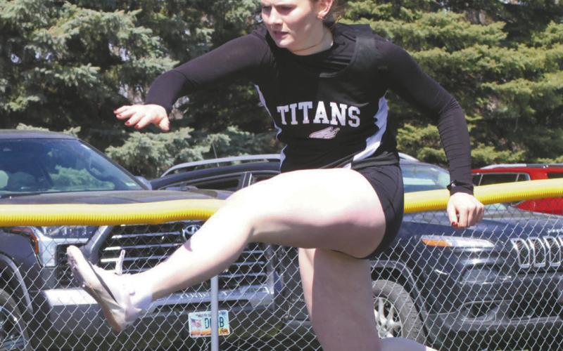 Finishing with a season best, DVE junior Ingrid Myrdal cleared the hurdles and placed 5th in the Girls 300 Hurdles. Photo by Jamie Rarick