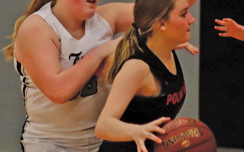 Isabella Douville guards a Polar Bear near their bucket in Tuesday nights matchup in Drayton. VNV Photo by Lesa Van Camp