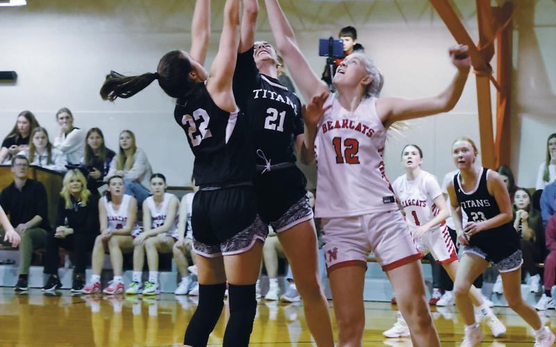 DVE's Jaelyn Johnson and Elizabeth Fedje fight North Star's Annabelle Staus for the rebound. Photo by Jamie Rarick