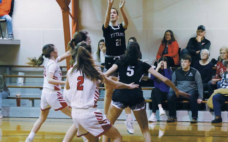 DVE senior Elizabeth Fedje goes for three during Friday's game in Starkweather. Photo by Jamie Rarick