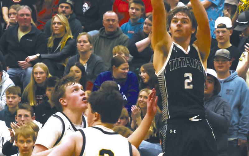 DVE's Teddy Otto goes for three during Tuesday night's game against Park River. Photo by Jamie Rarick