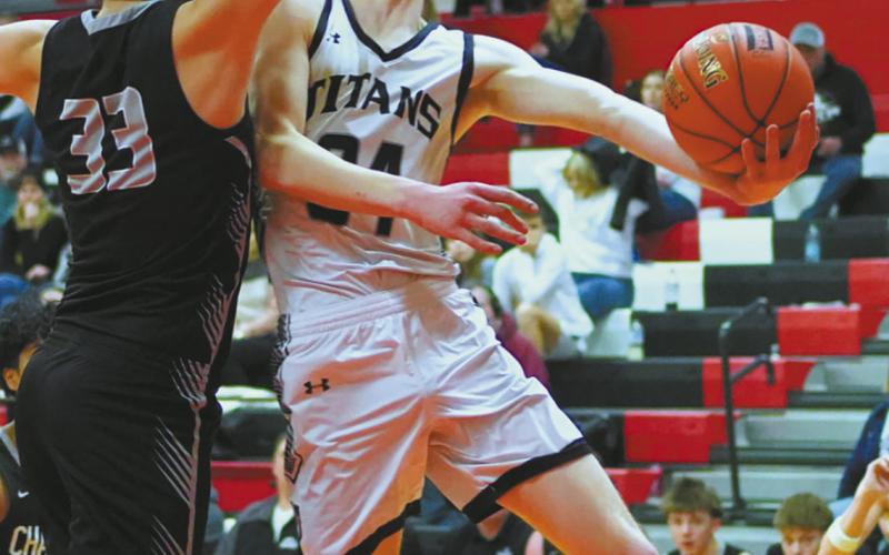 Nelson County defense blocks the shot attempted by DVE Senior Jack Langerud. Photo by Larry Stokke