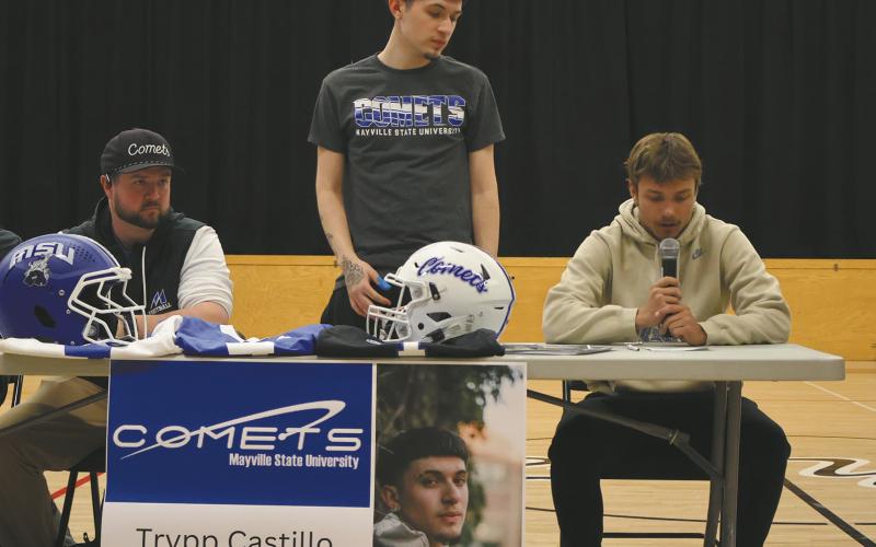 Trenton Bronson-Keena reads Trypp Castillo’s bio during Senior Signing Day. Photo by Rebecca Davis