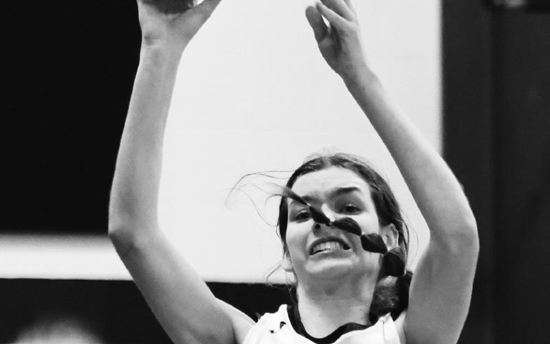 Elizabeth Fedje shoots over a crowd against Warwick. Photo by Lyle Van Camp.