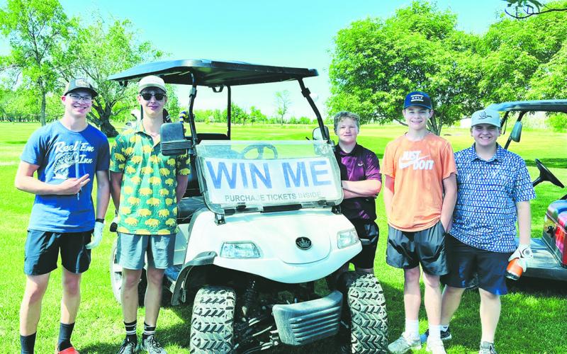 JJ Knudson, Gavin Ryan, Connor Corrick, Drew Passa and Jaxon Woinarowicz pose with the golf cart being raffled off. For a chance to win, contact Barbie Steenerson.