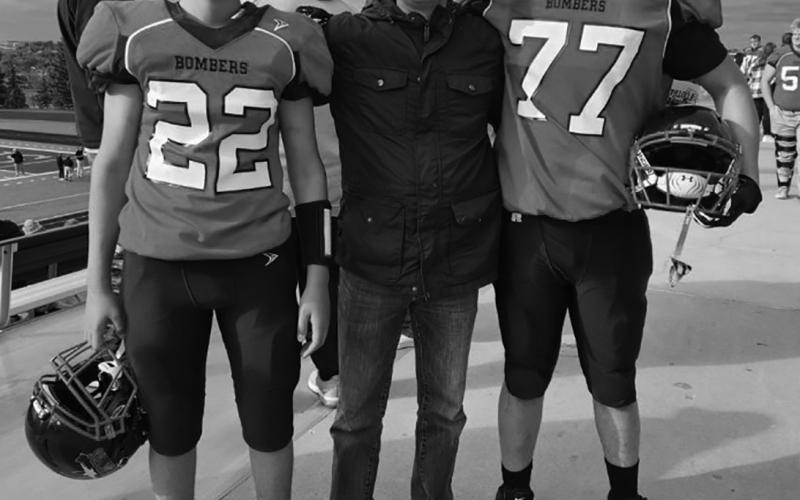 Tanio DeSouza accompanied by #22, his nephew Lucus DeSouza, and #77, his son Daniel DeSouza. Picture by Tanio’s daughter, Melissa, in Minot at the playoffs.