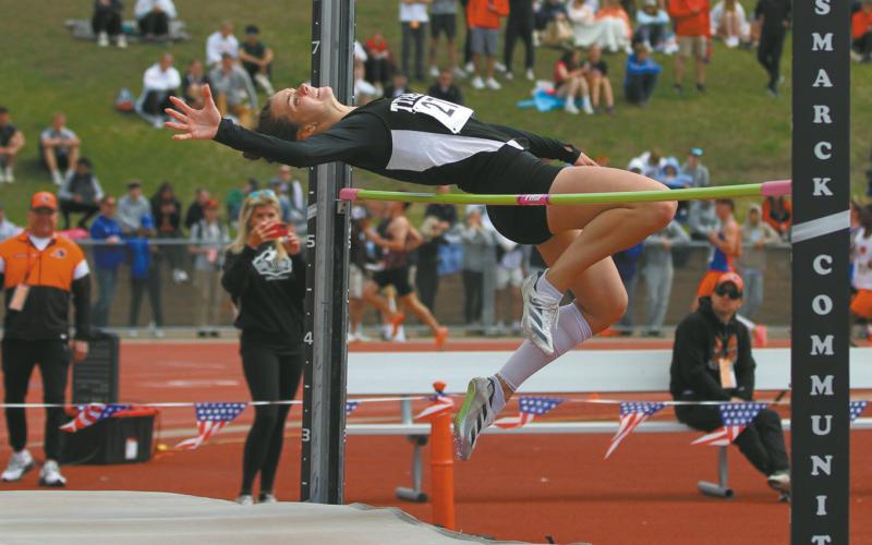 Junior Elizabeth Fedje clears the bar during the Class B Girls' High Jump Friday at the State Track Meet. Fedje won the state championship in the event, clearing 5-feet-6-inches. Photo by Mike Alan Steinfeldt