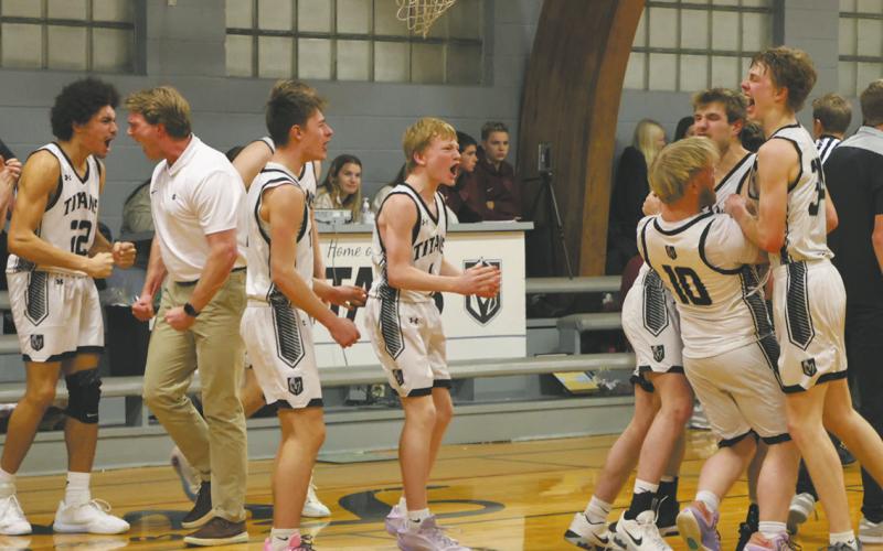 The DVE Titans celebrate following a come-from-behind win over the Langdon Cardinals with a last-minute shot. Photo by Jamie Rarick
