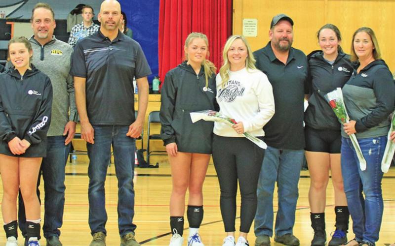 Pictured above left to right: Senior Titan volleyball players and their parents who where honored Saturday afternoon in the Drayton gym. Kim Hannesson, Kendra Hannesson, Troy Hannessson, Jeanette Gimmell, Chloe Gimmell, Ron Gimmell, Lisa Oberg, Hannah Oberg, Steve Oberg, Jamie Oberg, Katelyn Oberg, Mandy Oberg, Mark Hermanson, Maddison Hermanson, Jessica Hermanson, Sondra Verke, Aliyah Bartels, Ryan Bartels, Kerri Stegman, Kasey Stegman, and Wayne Stegman. VNV Photo by Lesa Van Camp
