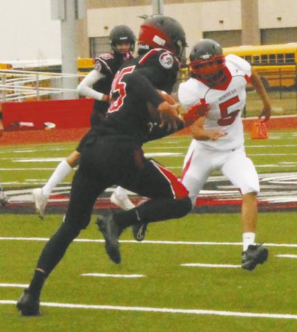 Defender Lucas De Souza chases down a White Shield ball carrier to prevent a first down. Photo by Jamie Rarick