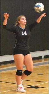 Aleah Pokrzywinski concentrates on her serve against HVC. Photo by Lyle Van Camp.