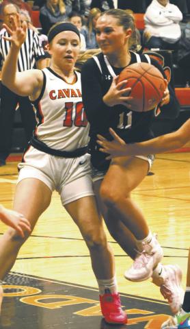 Jacey Nelson drives the lane. Photo by Lyle Van Camp
