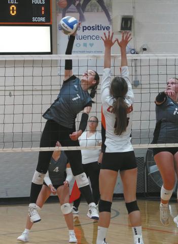 Elizabeth Fedje slams down one of her 15 kills in the Titans win over Cavalier Oct 3 in Cavalier. Photo by Larry Stokke