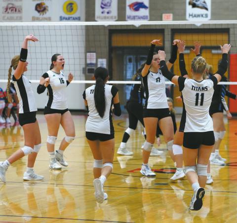 The team celebrates their hard work this season at the Region 2B Volleyball Tournament in Devils Lake, N.D. Photo by Larry Stokke.