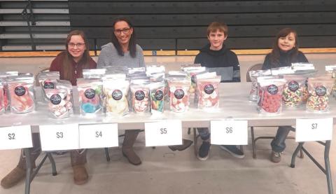 The Bromfields (left to right: Bailey, Lori, Barrett and Braylynn) sell their freeze dried creations at a local vendor event. Submitted photo