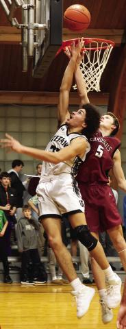 Facing heavy defense from Langdon's Terrell Henderson, DVE's Mason Pollestad fights for the shot. Photo by Jamie Rarick