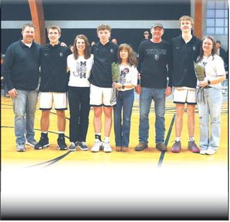 Together with their parents, DVE seniors Isaac Feltman, Frankie Duff, and Jack Langerud were recognized before Tuesday evening's game versus Park River in Crystal.  Photo by Jamie Rarick