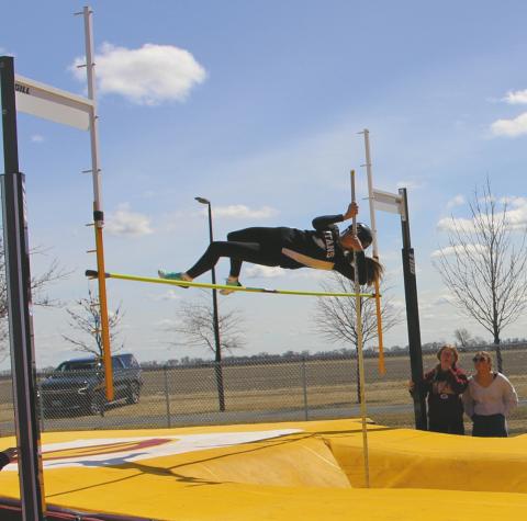 Rosalyn Fedje puts plenty if air between herself and the bar while pole vaulting at the meet in Grafton last week. Photo by Andrea Johnston