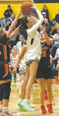 Fighting for the open shot, DVE's Gianna Hall fights a group of Cavalier defenders. Photo by Jamie Rarick
