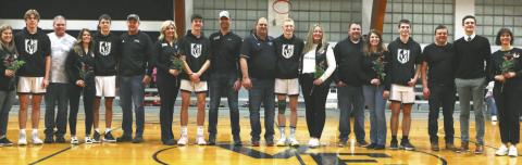 The Titans seniors stand with their parents on Senior Night, which was celebrated Feb. 13 at the game against Park River. Photo by Lyle Van Camp.