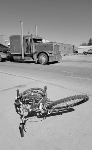 The victim's bicycle is seen lying on the sidewalk following the accident involving a semi near Hugo’s in Grafton. Photo by Mike Alan Steinfeldt