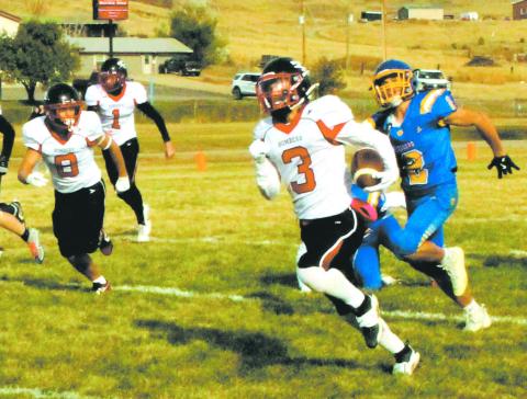 Trenten Keena outruns the Tiger defense to score another Bomber touchdown. Photo by Jamie Rarick.