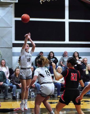 Easton Larson goes up for the shot at their play in game. Photo by Larry Stokke.